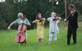 A group of people playing instruments in a field

AI-generated content may be incorrect.